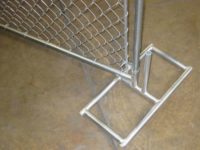 A chain link temporary fence panel installed with a square type galvanized steel feet.