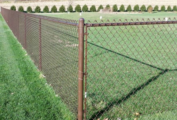 Brown vinyl-coated chain link fence.