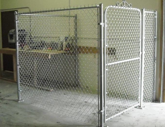 A chain link fence enclosure with single walk gate.