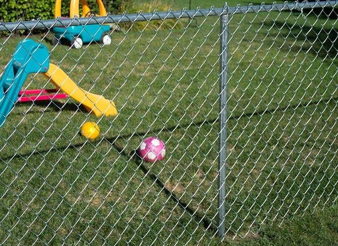 Galvanized before weaving chain link fence for the play yard.