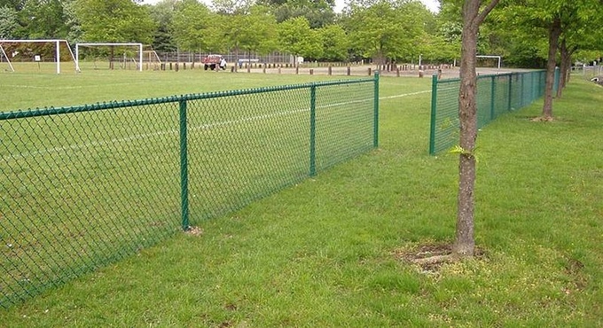 4-ft high green PVC-coated chain link fence around a sport filed.