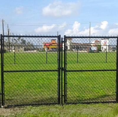 Black vinyl-coated double swing gate for business.